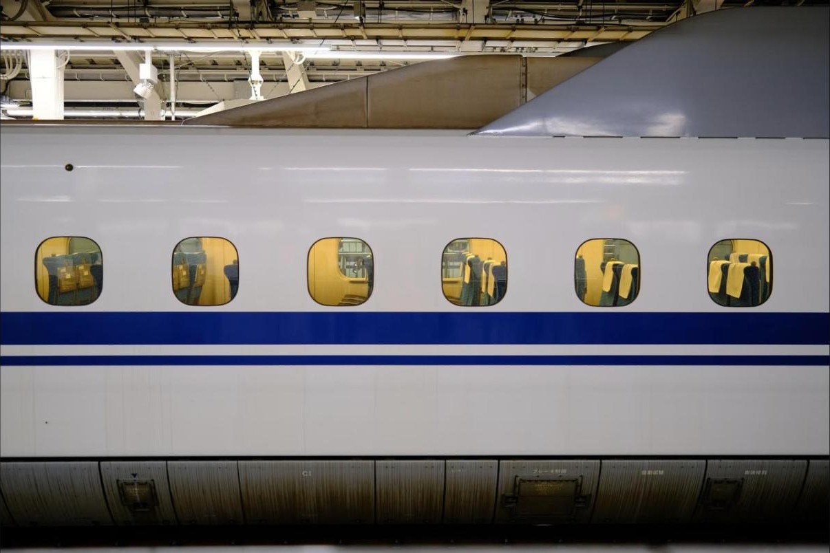 Close-up of a Shinkansen bullet train at a platform in Japan
